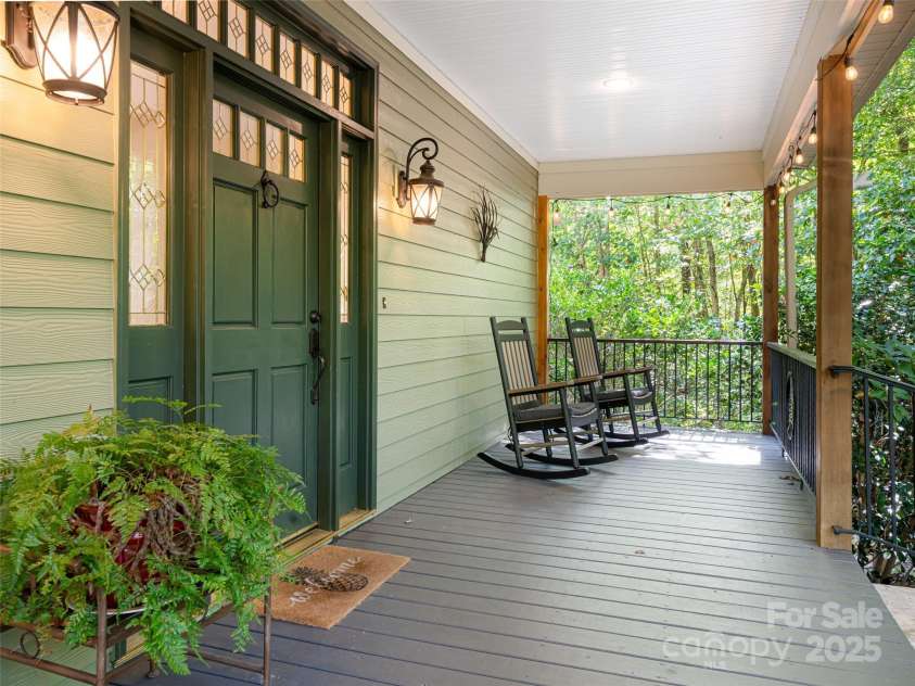 737 Streamside Drive, Arden, NC 28704.  MLS# CAR4248718, YatesRealty ID 16049. Rocking chair front porch
