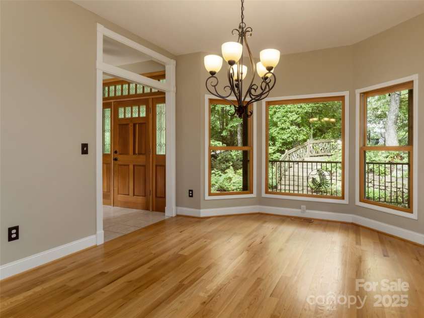 737 Streamside Drive, Arden, NC 28704.  MLS# CAR4248718, YatesRealty ID 16049. Th dining room has a beautiful view of the front yard