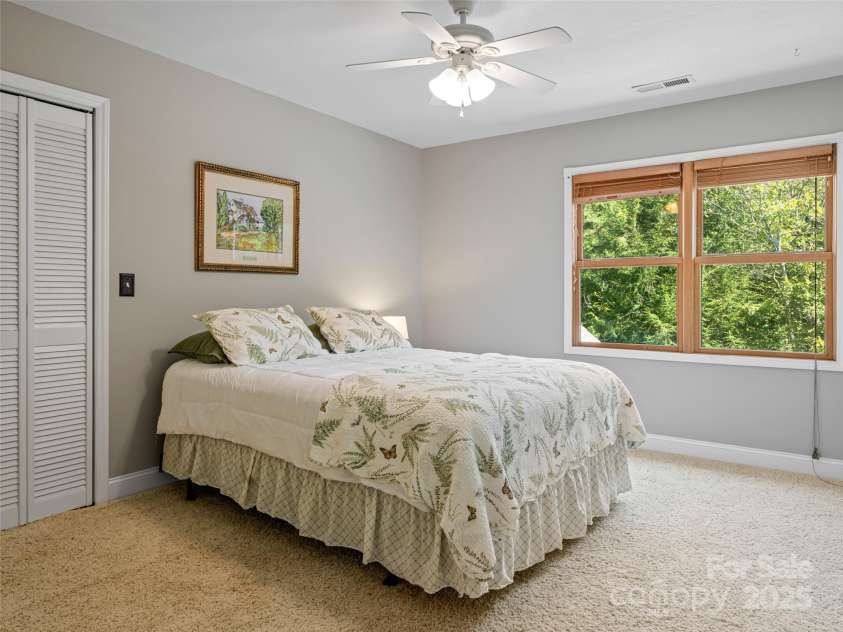 737 Streamside Drive, Arden, NC 28704.  MLS# CAR4248718, YatesRealty ID 16049. This bedroom over looks the back yard