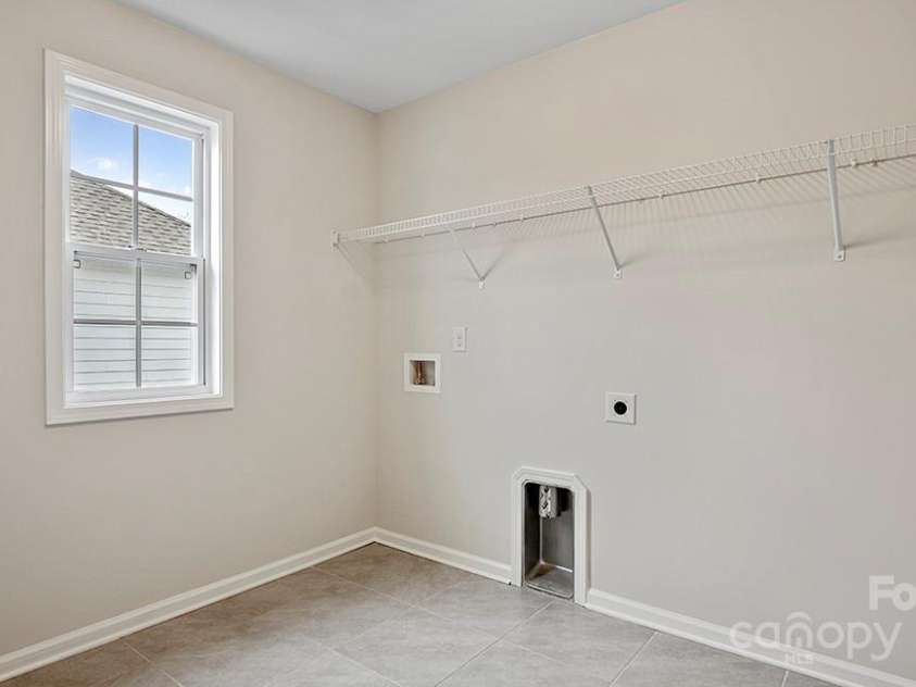 589 Fox Cove Road, Hendersonville, NC 28792.  MLS# CAR4199118, YatesRealty ID 1605. Laundry room on the second floor comes with a laundry tub.