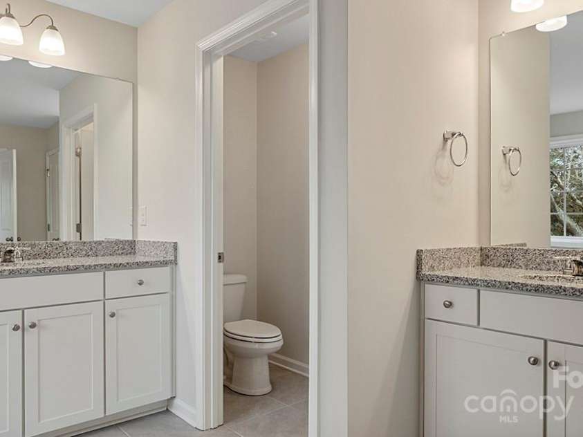 589 Fox Cove Road, Hendersonville, NC 28792.  MLS# CAR4199118, YatesRealty ID 1605. Shower and garden tub in primary bathroom