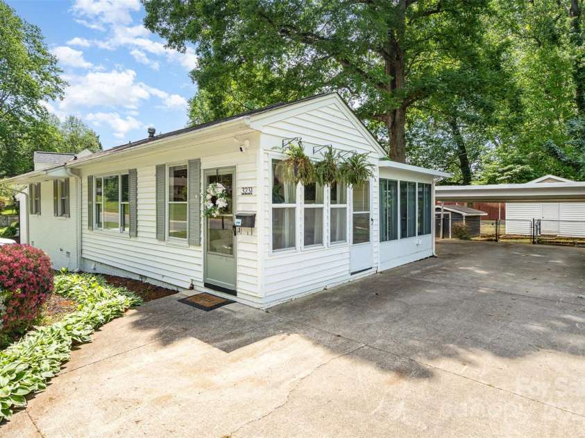 3231 Eastwood Drive, Charlotte, NC 28205.  MLS# CAR4228945, YatesRealty ID 16051. Covered carport for two cars with this ranch + basement home