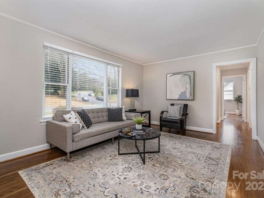 3231 Eastwood Drive, Charlotte, NC 28205.  MLS# CAR4228945, YatesRealty ID 16051. Living room boasts natural lighting