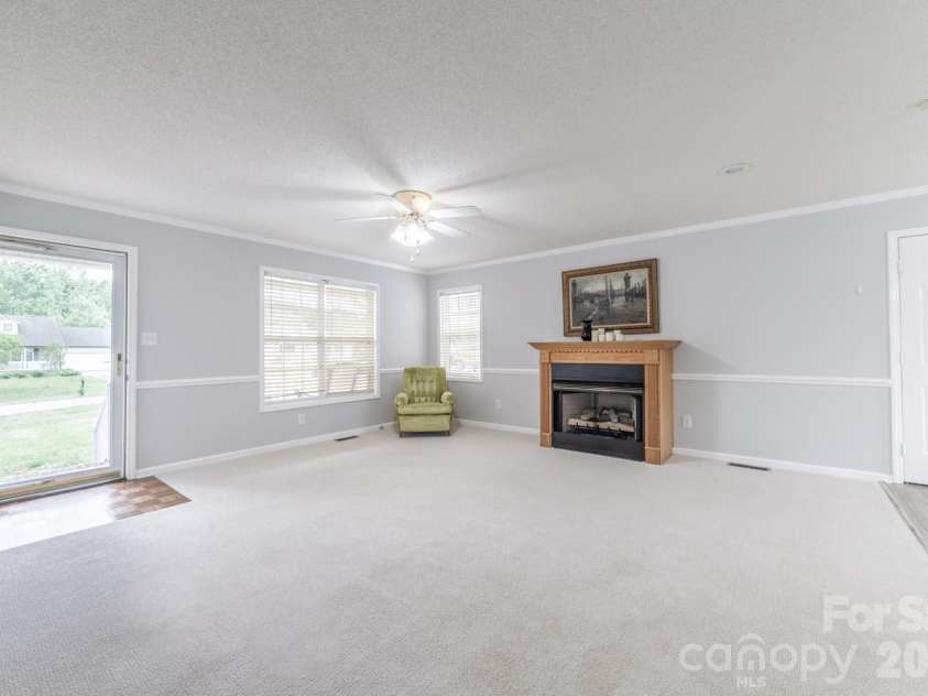 3971 Rolling Meadow Lane, Lincolnton, NC 28092.  MLS# CAR4373846, YatesRealty ID 16055. Cozy Living Room Fireplace