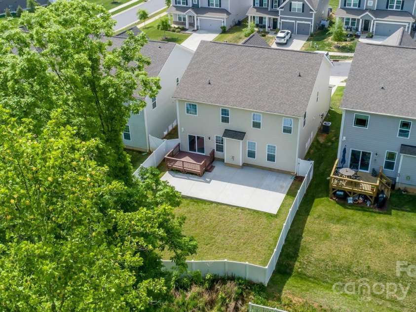 424 Preston Road, Mooresville, NC 28117.  MLS# CAR4252036, YatesRealty ID 16055. Beautiful tree lined fenced yard with deck and extended patio