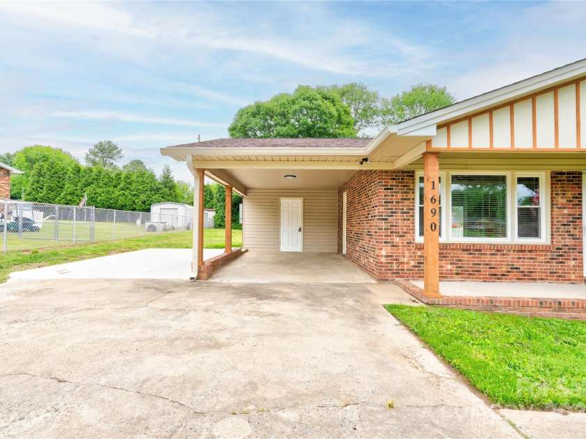 1690 Montevista Drive, Shelby, NC 28150.  MLS# CAR4256275, YatesRealty ID 16062. Attached Carport adn extra parking pad
