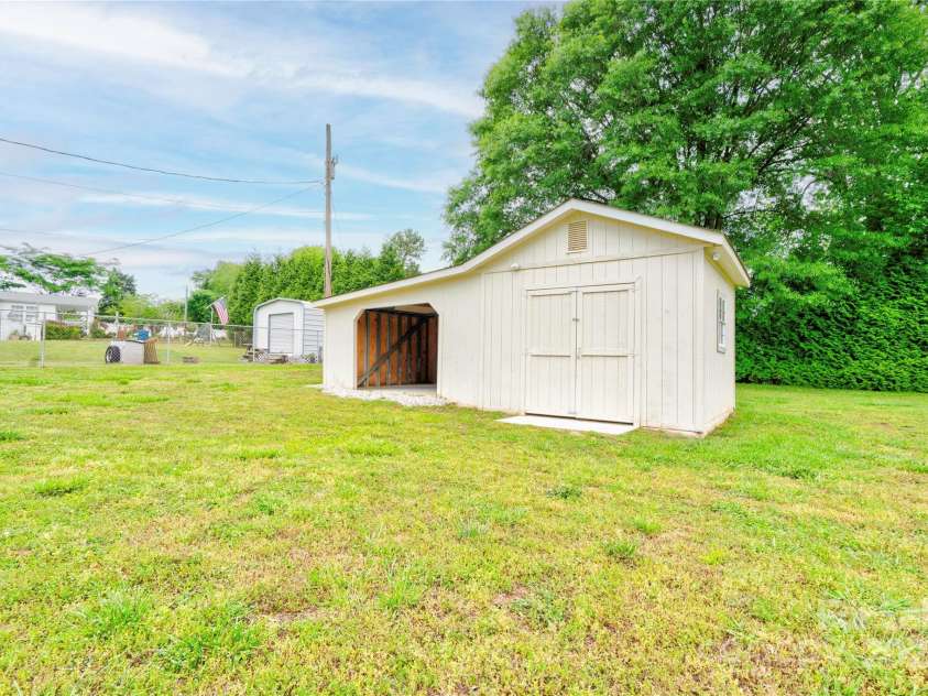 1690 Montevista Drive, Shelby, NC 28150.  MLS# CAR4256275, YatesRealty ID 16062. Storage Building w/ Carport