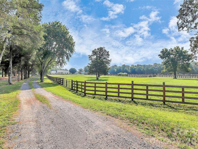 5008 Steele Village Road, Rock Hill, SC 29730.  MLS# CAR4363417, YatesRealty ID 16062. Entry/Drive Way Lined with Trees