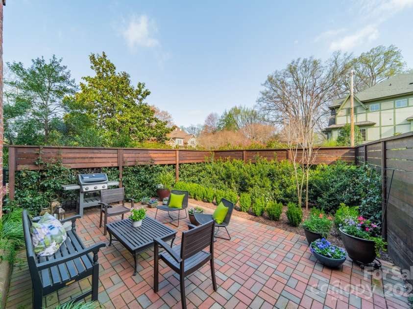 1801 Maryland Avenue, Charlotte, NC 28209.  MLS# CAR4235265, YatesRealty ID 16069. Side, enclosed patio off family room