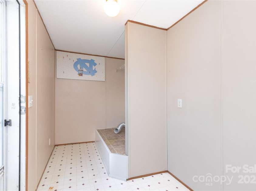 283 Grandview Drive, Marshall, NC 28753.  MLS# CAR4256159, YatesRealty ID 16074. Laundry/mud room with exterior door to small deck
