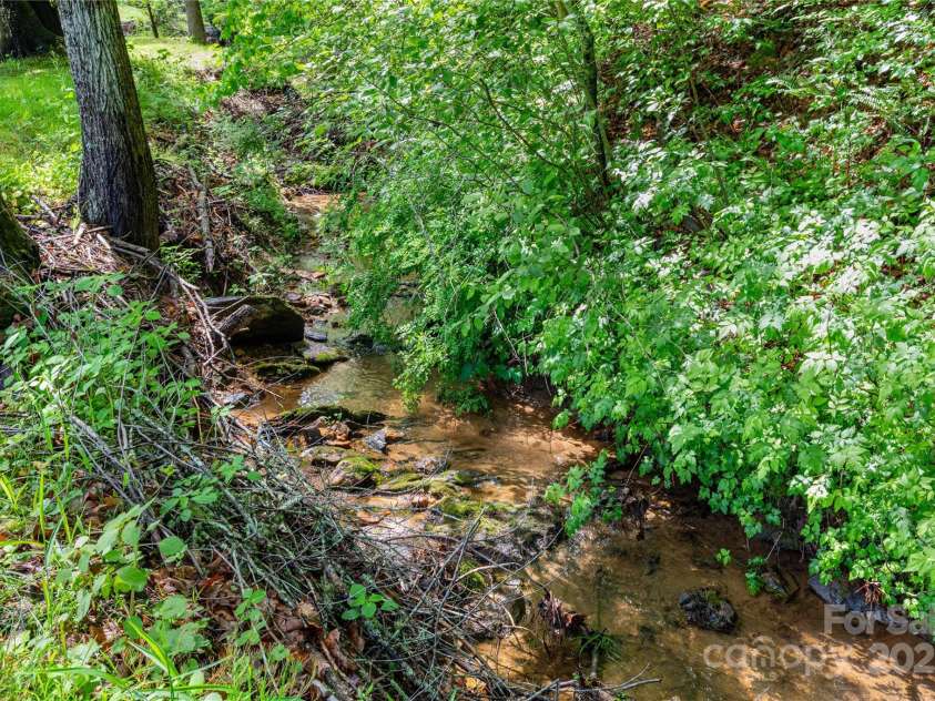 283 Grandview Drive, Marshall, NC 28753.  MLS# CAR4256159, YatesRealty ID 16074. Nice creek