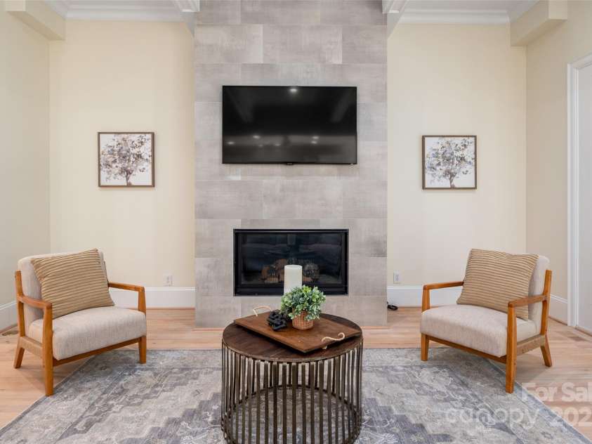 1500 Tarrington Way, Wesley Chapel, NC 28079.  MLS# CAR4260125, YatesRealty ID 16079. Family room with updated modern fireplace