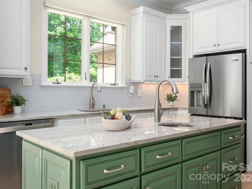 1500 Tarrington Way, Wesley Chapel, NC 28079.  MLS# CAR4260125, YatesRealty ID 16079. Kitchen sinks offers view of yard