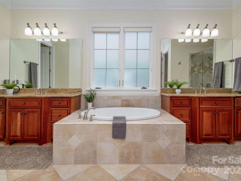 1500 Tarrington Way, Wesley Chapel, NC 28079.  MLS# CAR4260125, YatesRealty ID 16079. Primary ensuite with dual vanities and garden tub