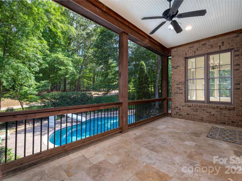 1500 Tarrington Way, Wesley Chapel, NC 28079.  MLS# CAR4260125, YatesRealty ID 16079. Rear covered deck overlooks heated pool