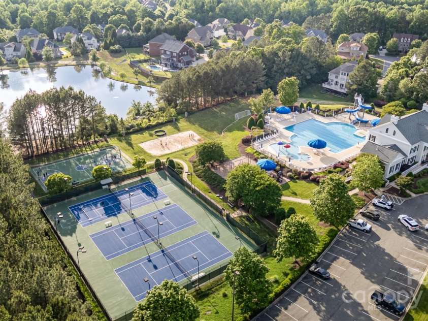 16109 Reynolds Drive, Indian Land, SC 29707.  MLS# CAR4255287, YatesRealty ID 16082. Amenities: tennis courts, sports courts, pools, clubhouse, gym, playground, pond with walking trail.