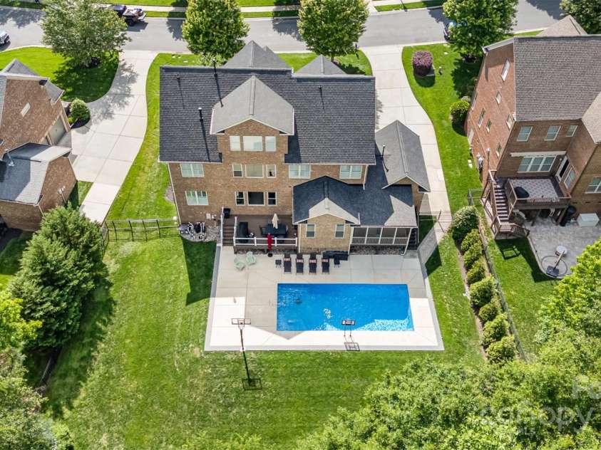 16109 Reynolds Drive, Indian Land, SC 29707.  MLS# CAR4255287, YatesRealty ID 16082. Backyard featuring a new Roof and a 2023 Sea Salt Pool