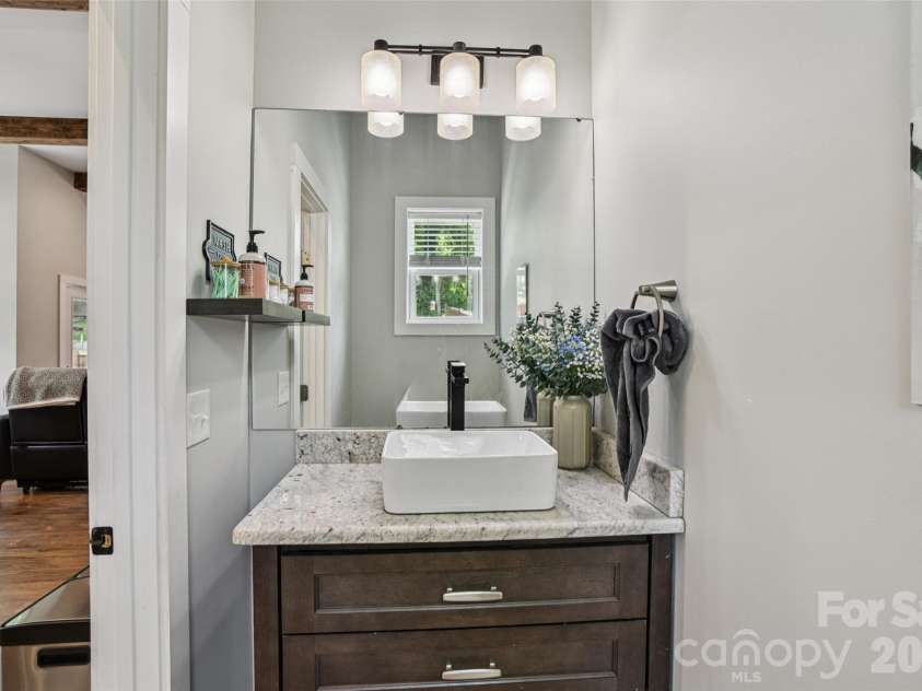 8 Apple Lane, Asheville, NC 28804.  MLS# CAR4354022, YatesRealty ID 16087. Convenient half bath located on the main level