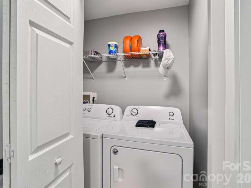 8 Apple Lane, Asheville, NC 28804.  MLS# CAR4354022, YatesRealty ID 16087. Convenient laundry closet with shelving space