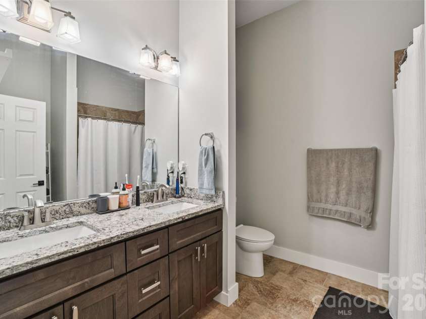 8 Apple Lane, Asheville, NC 28804.  MLS# CAR4354022, YatesRealty ID 16087. En-suite bath with dual vanities