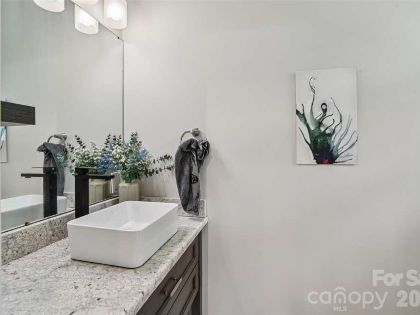 8 Apple Lane, Asheville, NC 28804.  MLS# CAR4354022, YatesRealty ID 16087. Main level half bath with modern touches