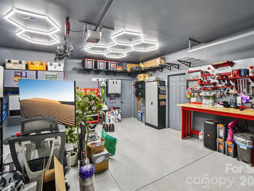 8 Apple Lane, Asheville, NC 28804.  MLS# CAR4354022, YatesRealty ID 16087. Spacious double garage with ample storage for vehicles and gear