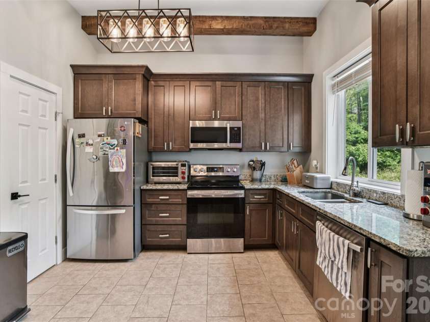 8 Apple Lane, Asheville, NC 28804.  MLS# CAR4354022, YatesRealty ID 16087. Stylish kitchen with granite countertops