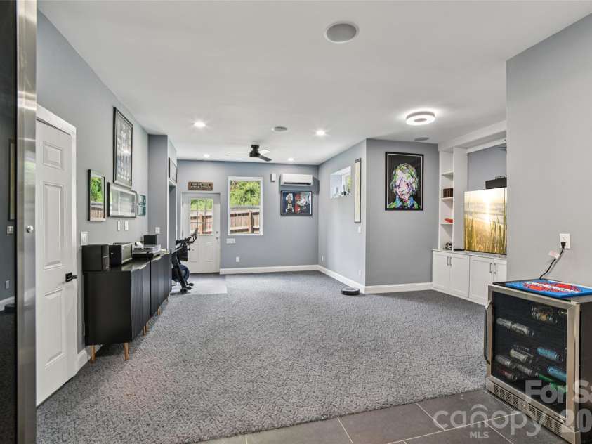 8 Apple Lane, Asheville, NC 28804.  MLS# CAR4354022, YatesRealty ID 16087. Versatile lower level space with half bath and laundry hookup