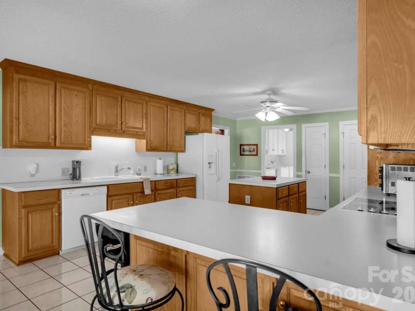 824 Forest Hills School Road, Marshville, NC 28103.  MLS# CAR4353815, YatesRealty ID 16088. Large kitchen with breakfast bar and island