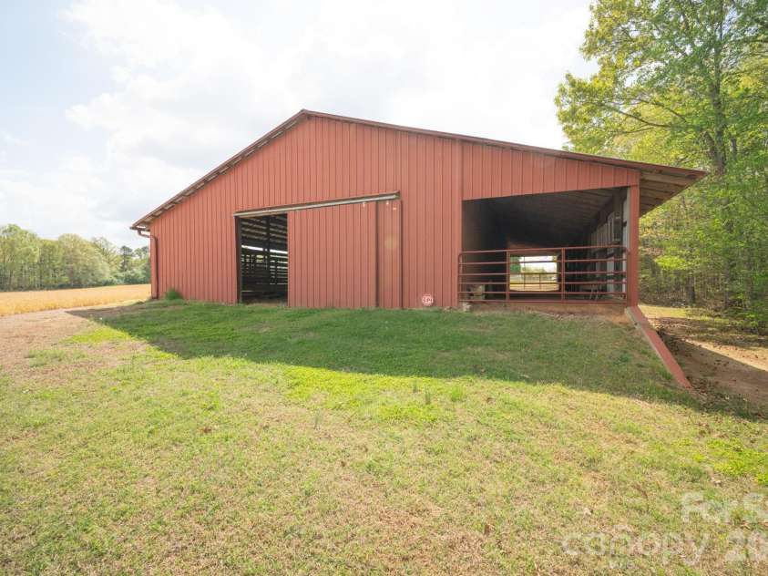 824 Forest Hills School Road, Marshville, NC 28103.  MLS# CAR4353815, YatesRealty ID 16088. Multi-purpose barn could be a horse barn, hobby barn, cow barn,
