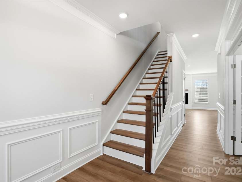 6027 Veld Court, Charlotte, NC 28215.  MLS# CAR4257024, YatesRealty ID 16096. Composite stair treads & metal balusters
