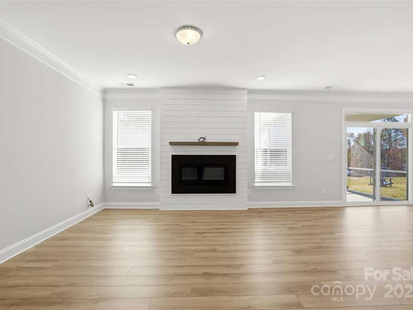 6027 Veld Court, Charlotte, NC 28215.  MLS# CAR4257024, YatesRealty ID 16096. Family room with fireplace and shiplap wall