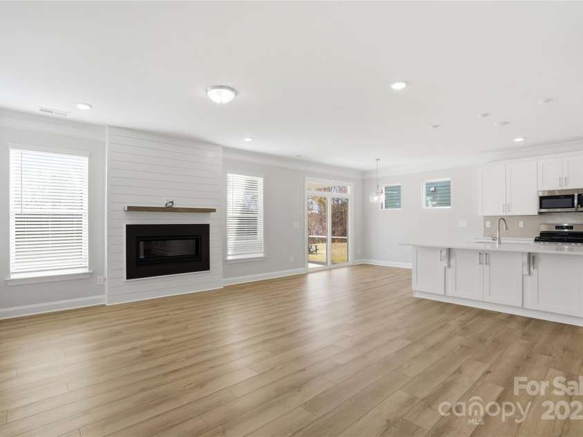 6027 Veld Court, Charlotte, NC 28215.  MLS# CAR4257024, YatesRealty ID 16096. Family room with fireplace and shiplap wall