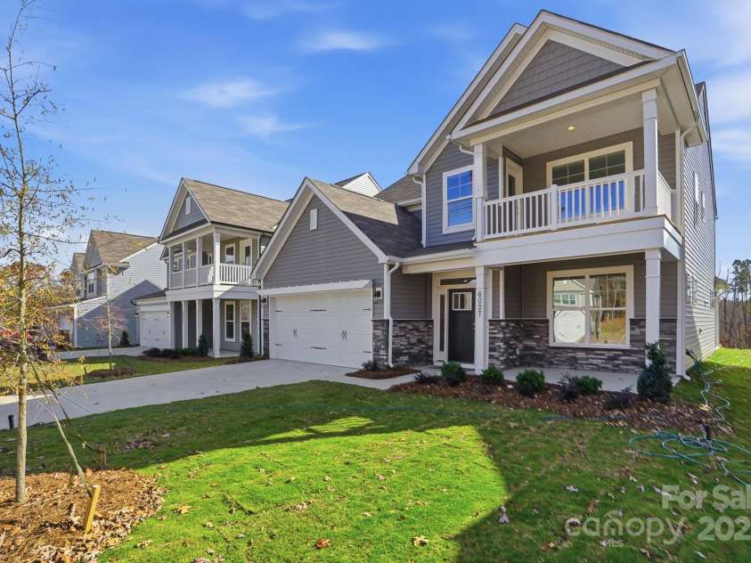 6027 Veld Court, Charlotte, NC 28215.  MLS# CAR4257024, YatesRealty ID 16096. Features a front porch with upper balcony