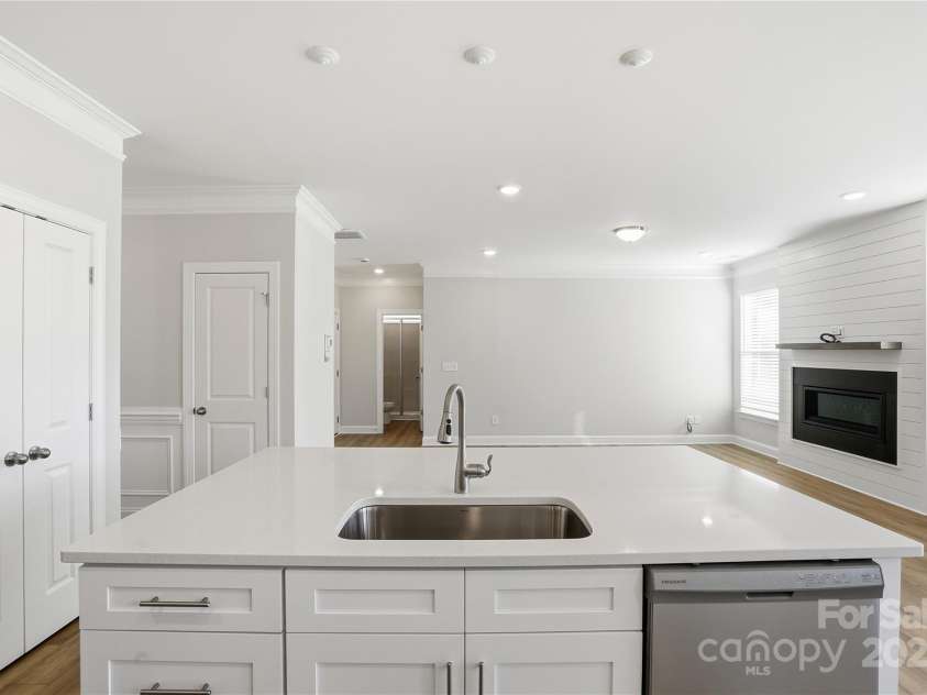 6027 Veld Court, Charlotte, NC 28215.  MLS# CAR4257024, YatesRealty ID 16096. Kitchen island faces the family room