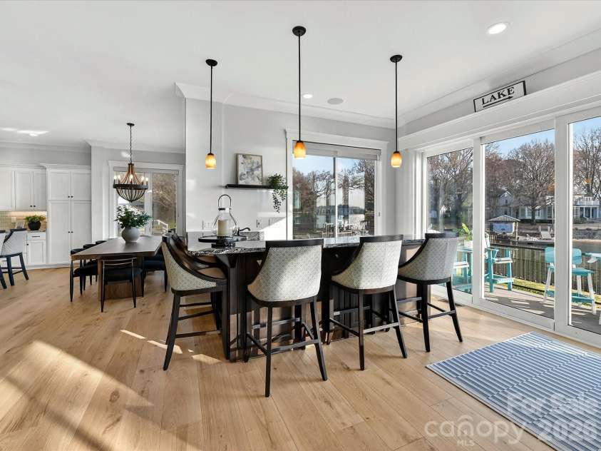 18014 Whispering Oaks Drive, Cornelius, NC 28031.  MLS# CAR4356897, YatesRealty ID 16097. Exceptional chef's kitchen combines elegant finishes, extensive cabinetry, premium appliances, and a spacious island designed for everyday living and effortless entertaining.