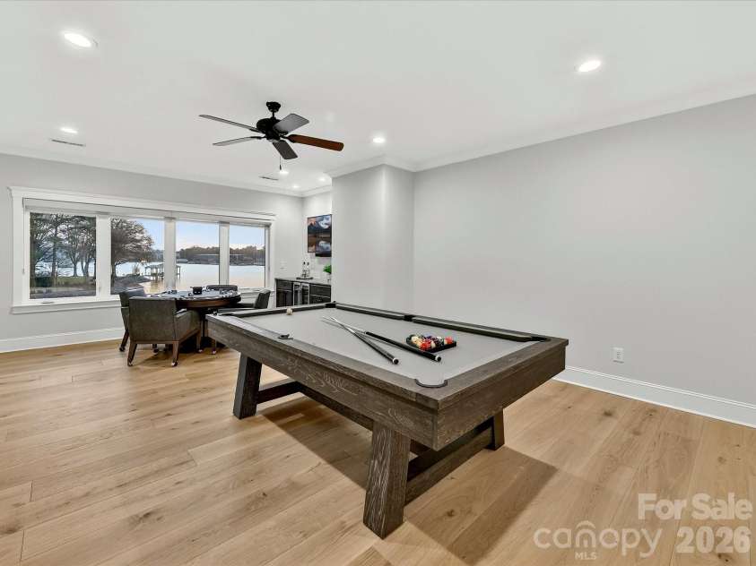 18014 Whispering Oaks Drive, Cornelius, NC 28031.  MLS# CAR4356897, YatesRealty ID 16097. Spacious second-floor recreation room offers the perfect setting for billiards, games, entertaining, or relaxing while enjoying scenic lake views.