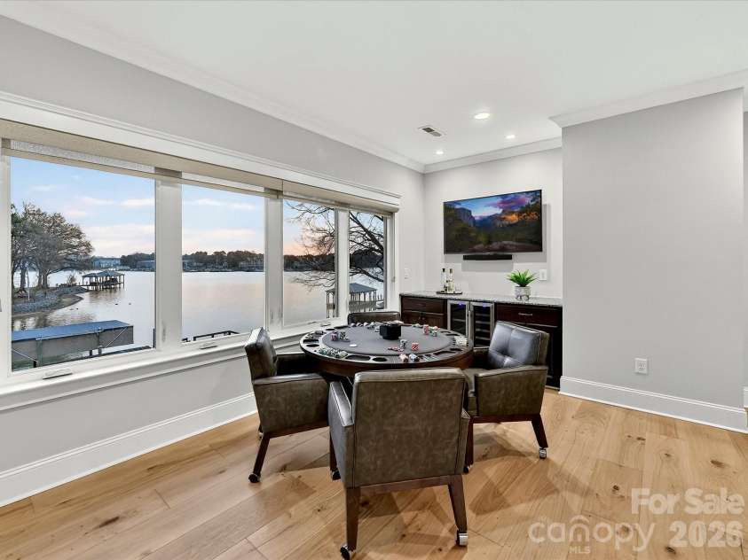 18014 Whispering Oaks Drive, Cornelius, NC 28031.  MLS# CAR4356897, YatesRealty ID 16097. Spacious second-floor recreation room offers the perfect setting for billiards, games, entertaining, or relaxing while enjoying scenic lake views.