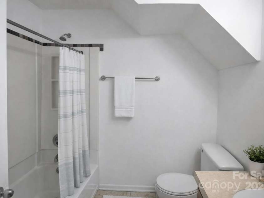 9432-D Lexington Circle, Charlotte, NC 28213.  MLS# CAR4332277, YatesRealty ID 1610. Primary bath downstairs staged