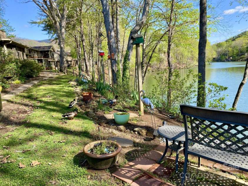 102 Lake Drive, Lake Lure, NC 28746.  MLS# CAR4245174, YatesRealty ID 16100. Back of building overlooking lake