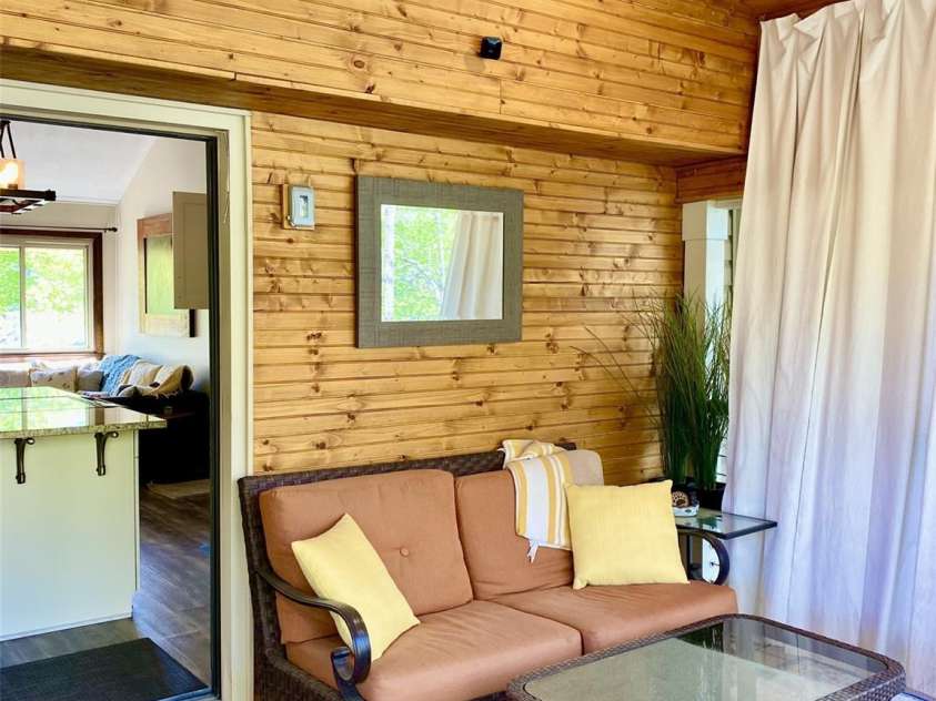 102 Lake Drive, Lake Lure, NC 28746.  MLS# CAR4245174, YatesRealty ID 16100. Beautiful wood accents on the porch area