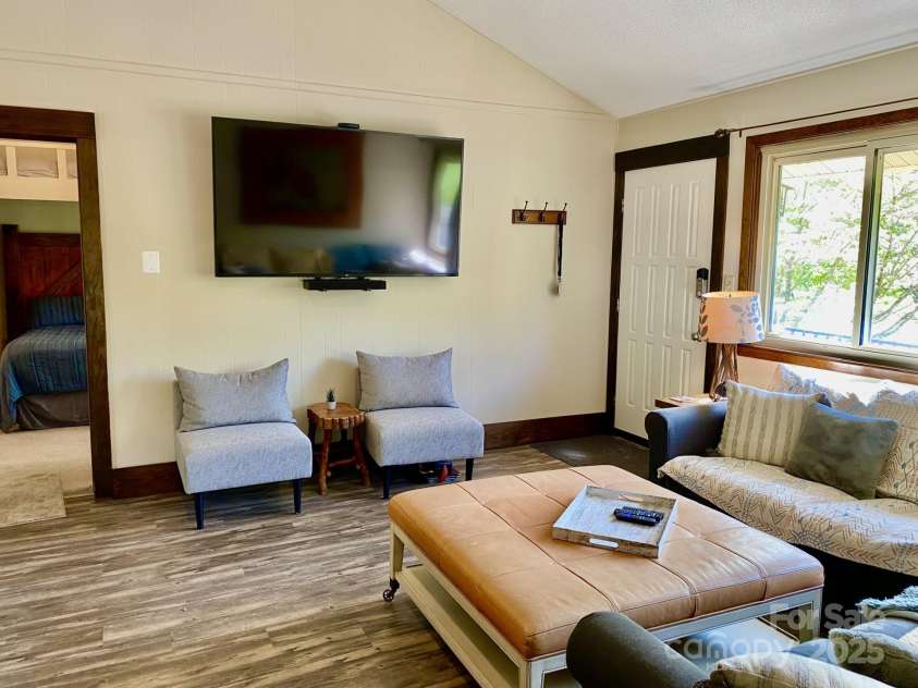 102 Lake Drive, Lake Lure, NC 28746.  MLS# CAR4245174, YatesRealty ID 16100. Large flat screen TV