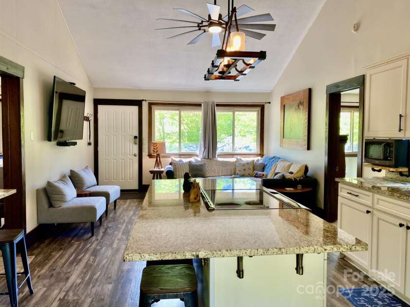 102 Lake Drive, Lake Lure, NC 28746.  MLS# CAR4245174, YatesRealty ID 16100. Open concert main area with kitchen living room