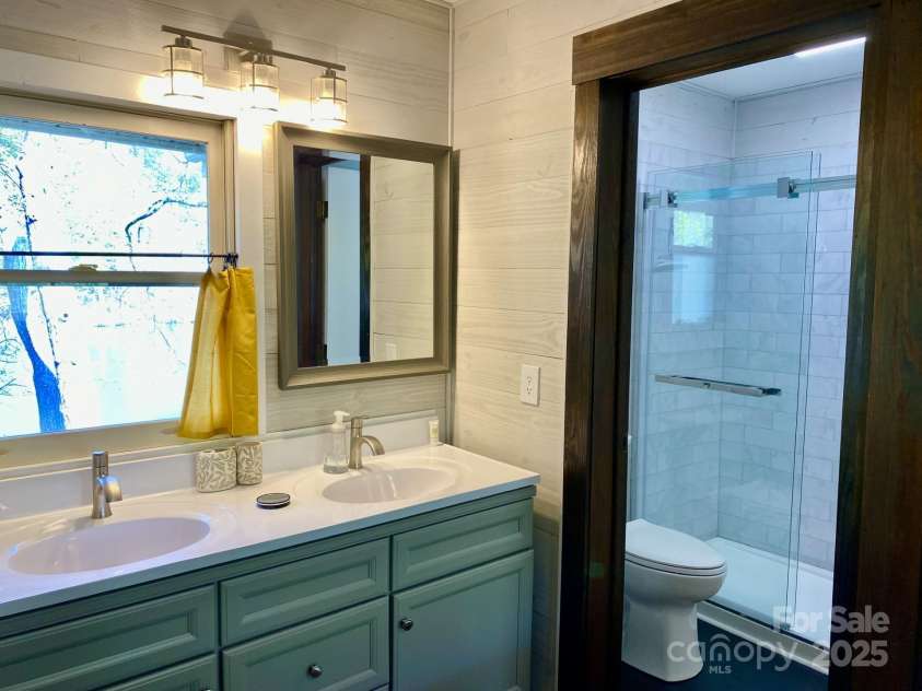 102 Lake Drive, Lake Lure, NC 28746.  MLS# CAR4245174, YatesRealty ID 16100. Renovated bathroom with double sink