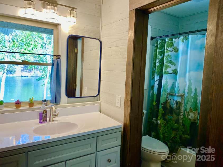 102 Lake Drive, Lake Lure, NC 28746.  MLS# CAR4245174, YatesRealty ID 16100. Second bath also renovated