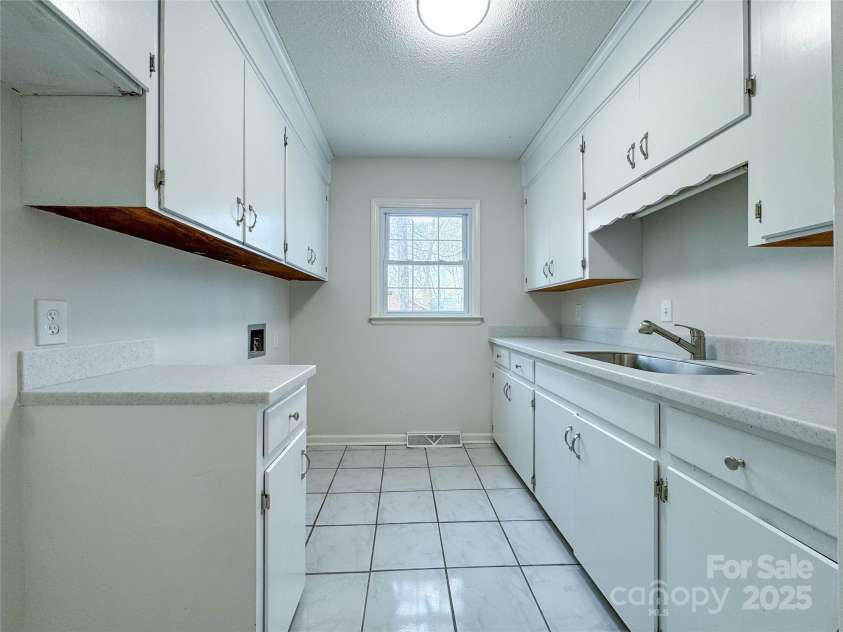 12011 Stoney Meadow Drive, Mint Hill, NC 28227.  MLS# CAR4240871, YatesRealty ID 16104. Laundry Room with additional storage