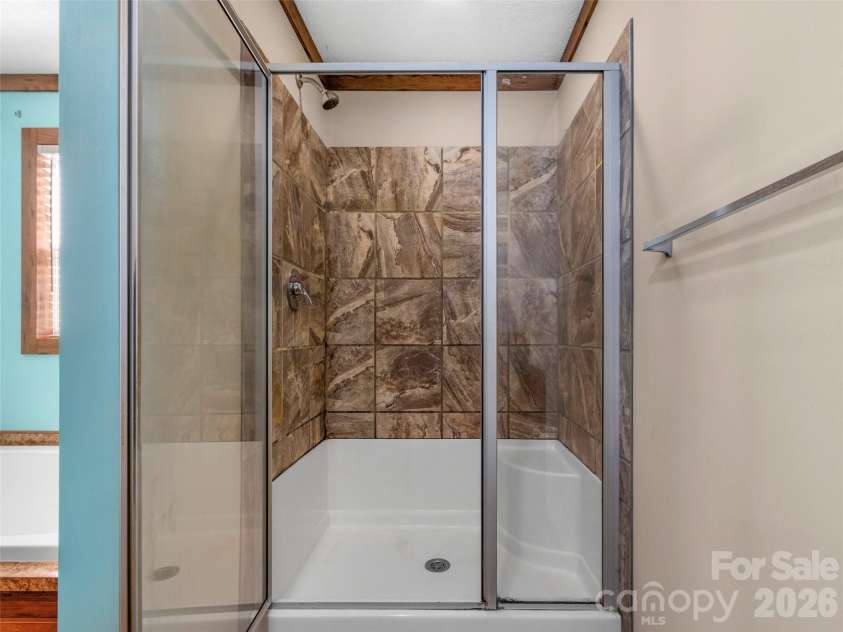 695 Johnson Farm Road, Canton, NC 28716.  MLS# CAR4359837, YatesRealty ID 16107. Primary Shower 