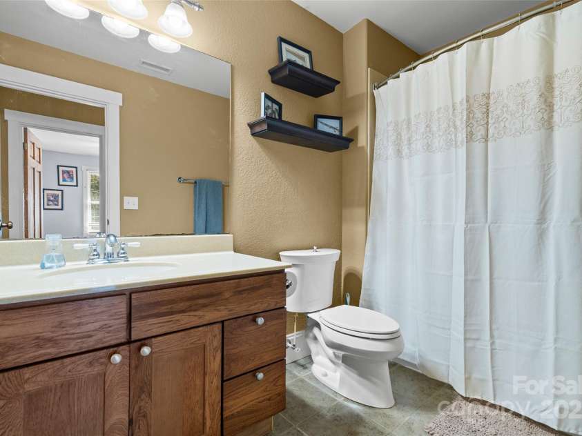 571 Terrys Gap Road, Fletcher, NC 28732.  MLS# CAR4330724, YatesRealty ID 1611. Guest bath