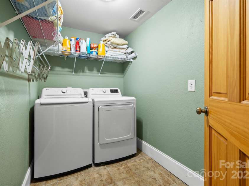 571 Terrys Gap Road, Fletcher, NC 28732.  MLS# CAR4330724, YatesRealty ID 1611. Laundry on main