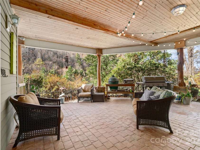 571 Terrys Gap Road, Fletcher, NC 28732.  MLS# CAR4330724, YatesRealty ID 1611. More outdoor, covered patio
